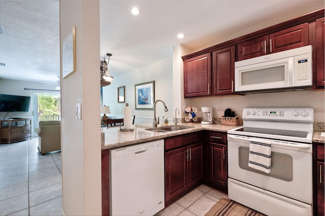 kitchen with light tile patterned flooring, pendant lighting, sink, ceiling fan, and white appliances