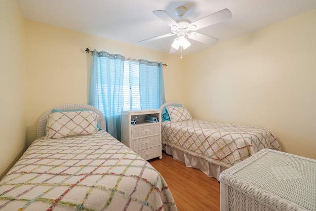 bedroom featuring wood-type flooring and ceiling fan