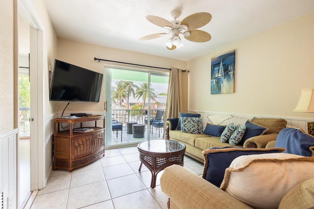 tiled living room featuring ceiling fan