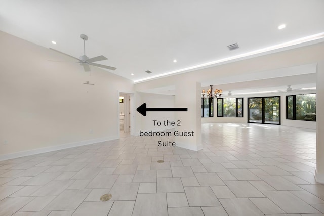 unfurnished room with recessed lighting, visible vents, lofted ceiling, and ceiling fan with notable chandelier
