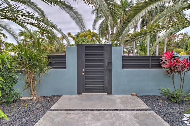 view of gate featuring fence