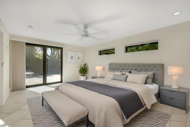 bedroom featuring a ceiling fan, light tile patterned flooring, and access to exterior