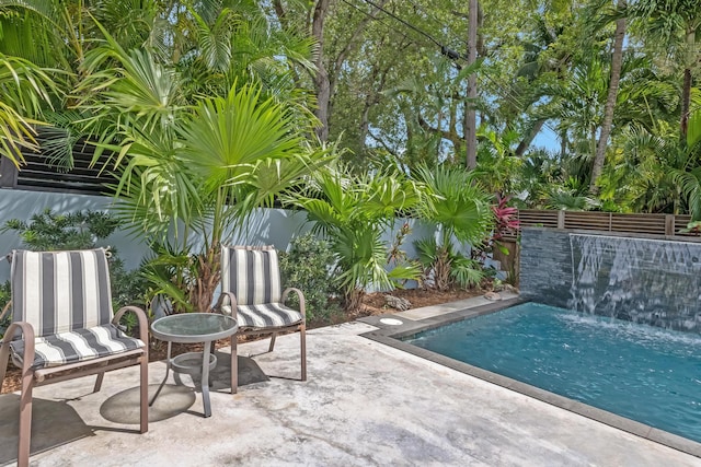view of patio featuring a fenced in pool and a fenced backyard