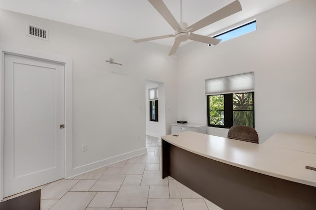 interior space featuring visible vents, a ceiling fan, and light tile patterned floors
