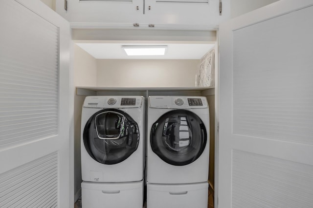 laundry room featuring laundry area and washing machine and clothes dryer