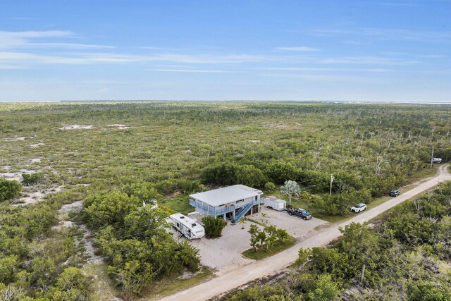 aerial view featuring a wooded view