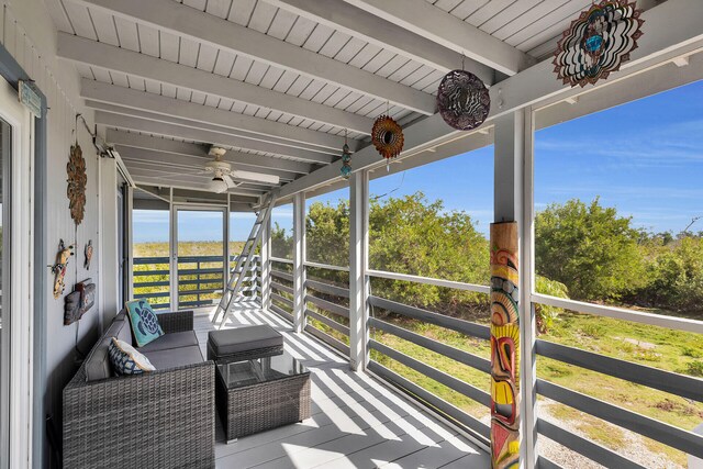 sunroom with wooden ceiling and beam ceiling