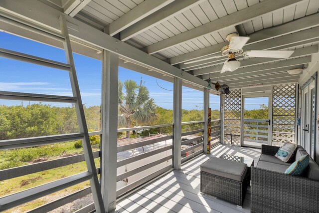 wooden terrace with a ceiling fan