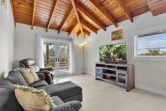 living area with baseboards, wooden ceiling, light wood-style flooring, vaulted ceiling with beams, and french doors