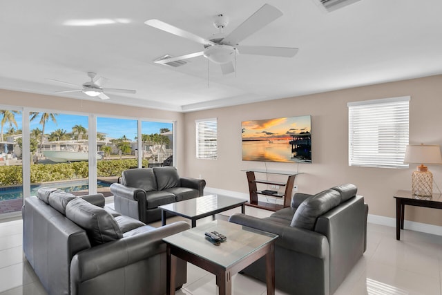 tiled living room featuring ceiling fan