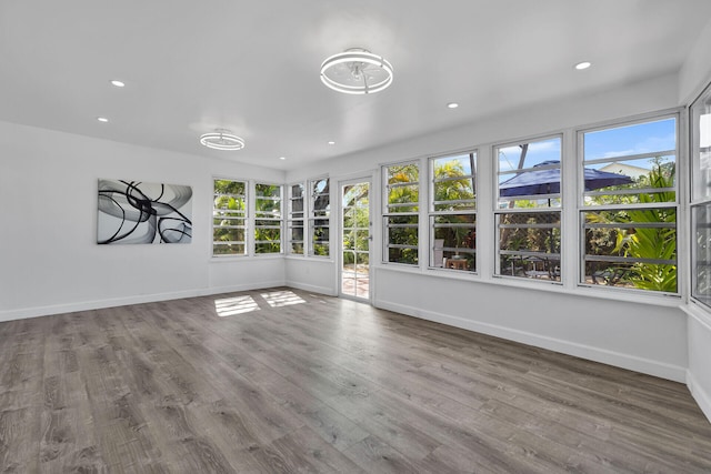 1513 5th St, Key West, FL 33040 - unfurnished sunroom with baseboards, recessed lighting, and wood finished floors