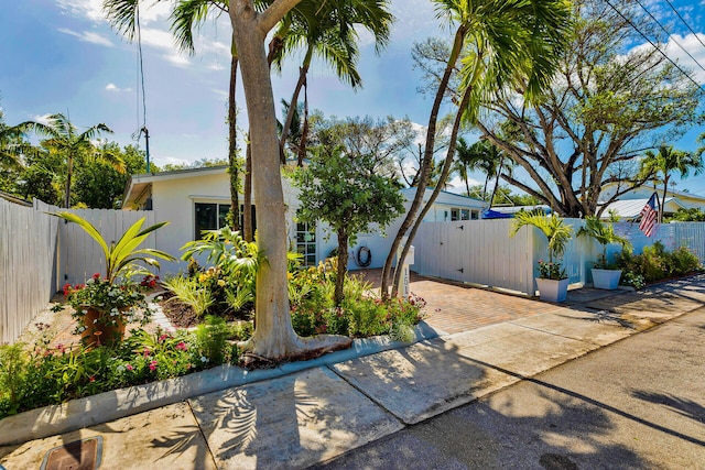 1513 5th St, Key West, FL 33040 - view of front facade featuring stucco siding and a gate