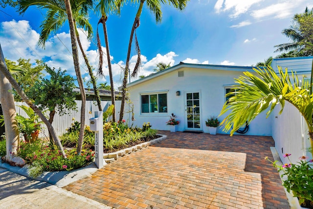 1513 5th St, Key West, FL 33040 - view of front of home with stucco siding and fence