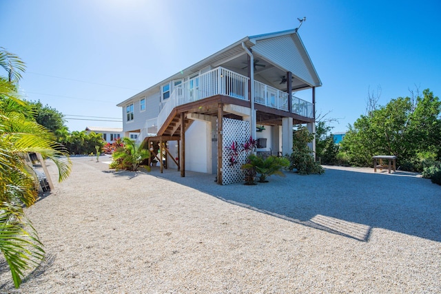 back of house featuring ceiling fan