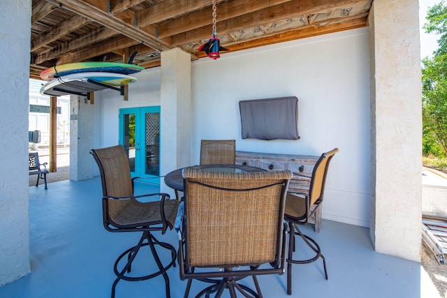 view of patio / terrace with an outdoor bar and french doors