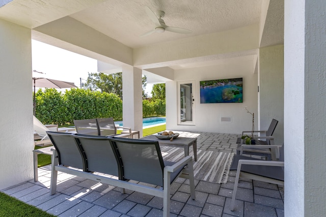 view of patio / terrace featuring ceiling fan