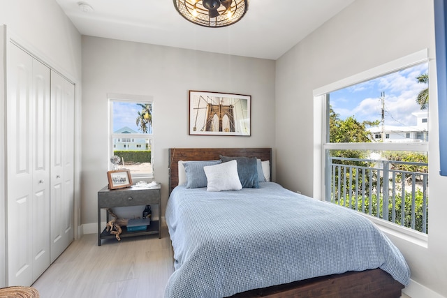 bedroom featuring light wood-type flooring and a closet