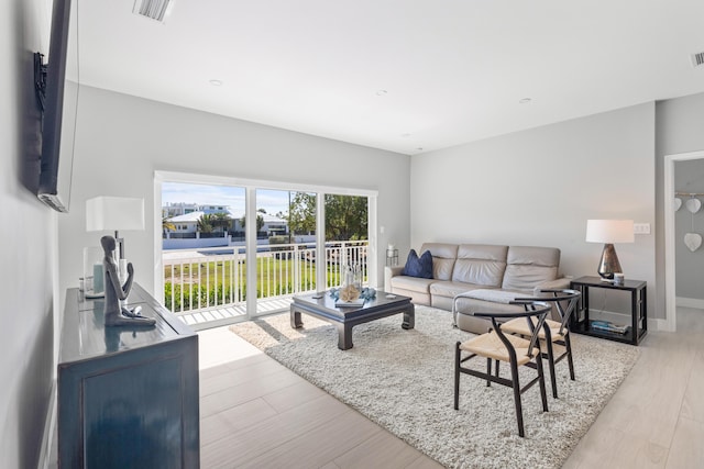 living room with light hardwood / wood-style flooring