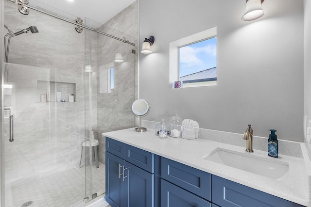 bathroom featuring vanity and an enclosed shower