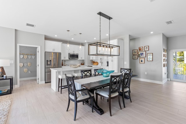 dining room with light hardwood / wood-style flooring