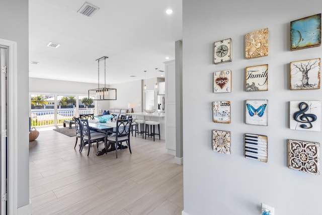 dining space with light hardwood / wood-style floors