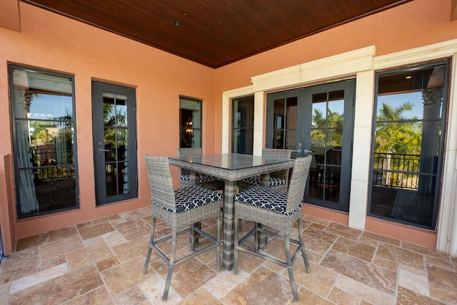 30 Cannon Royal Dr, Shark Key, FL 33040 - view of patio featuring french doors and outdoor dining space