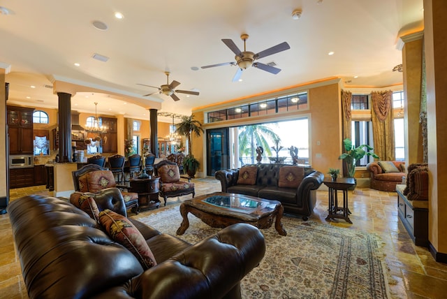 30 Cannon Royal Dr, Shark Key, FL 33040 - living area with crown molding, recessed lighting, ornate columns, and stone tile flooring