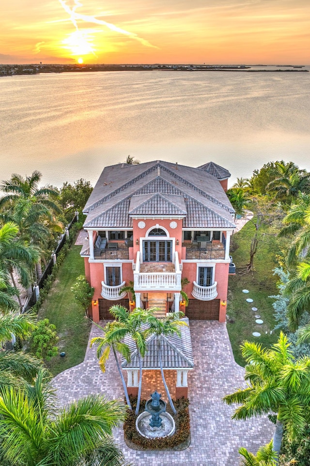 30 Cannon Royal Dr, Shark Key, FL 33040 - back of house at dusk with a water view and a balcony