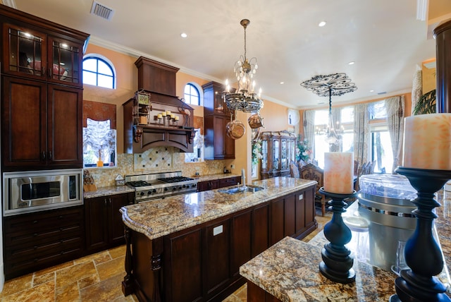 30 Cannon Royal Dr, Shark Key, FL 33040 - kitchen featuring visible vents, a sink, a chandelier, stainless steel appliances, and a wealth of natural light