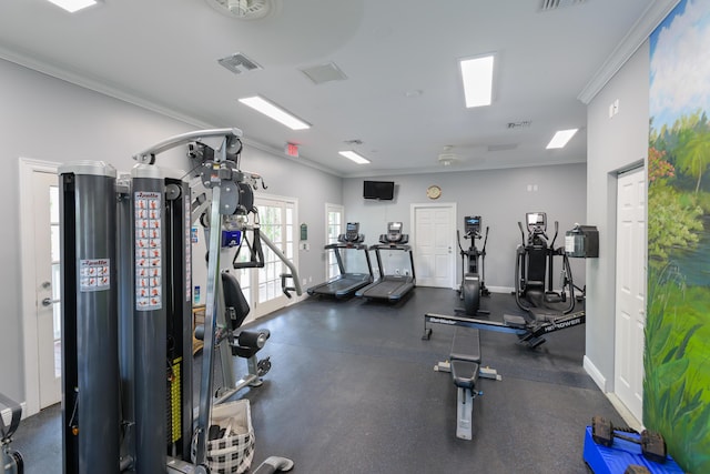 gym featuring baseboards, visible vents, and crown molding