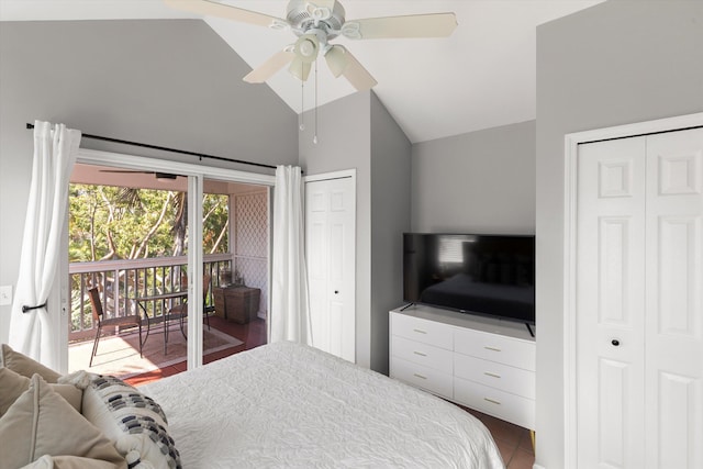 bedroom with vaulted ceiling, a ceiling fan, access to exterior, and multiple closets