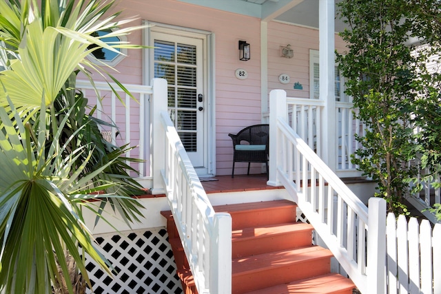 doorway to property featuring covered porch