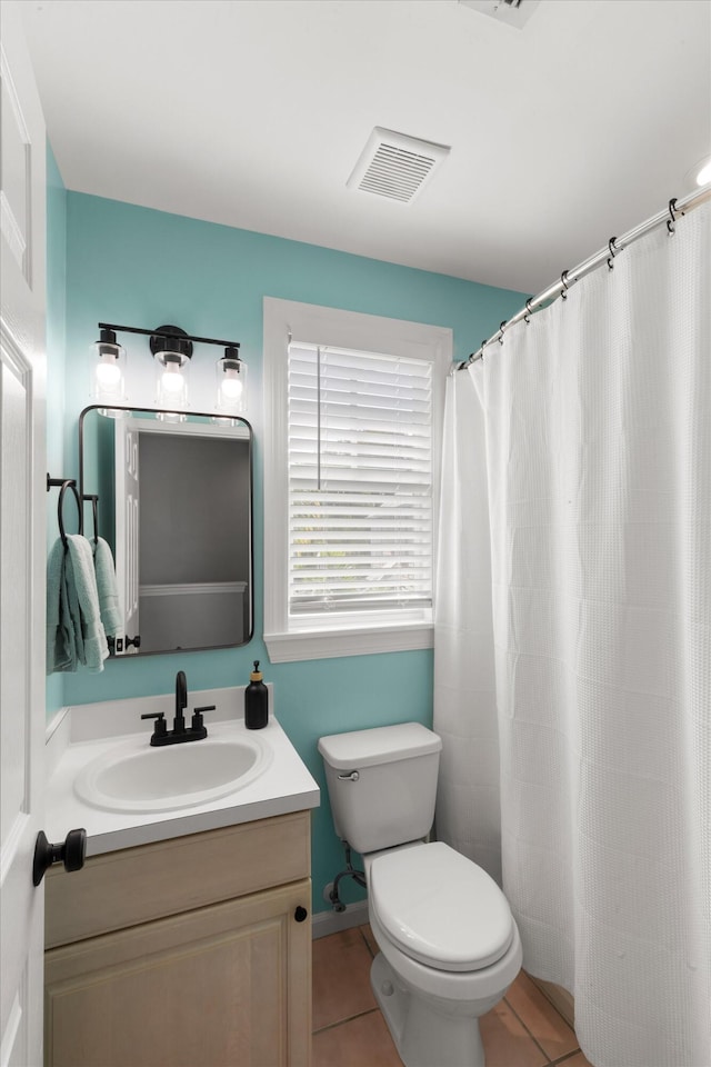 full bath featuring toilet, a shower with shower curtain, vanity, visible vents, and tile patterned floors