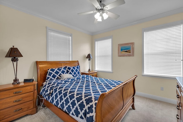 bedroom featuring baseboards, ceiling fan, light colored carpet, and crown molding