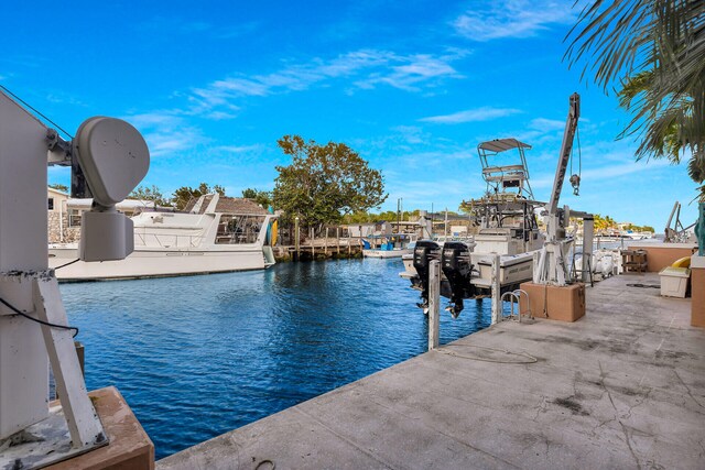 view of dock with a water view and boat lift