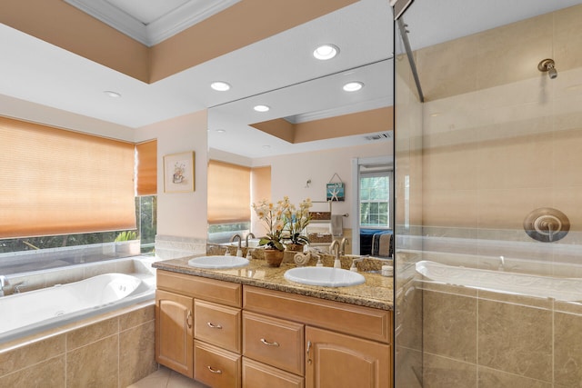 full bathroom featuring a garden tub, ornamental molding, a sink, and tiled shower