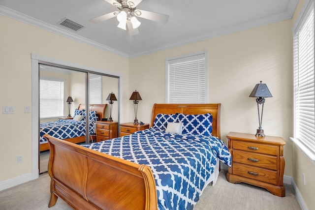 bedroom with light carpet, visible vents, and crown molding