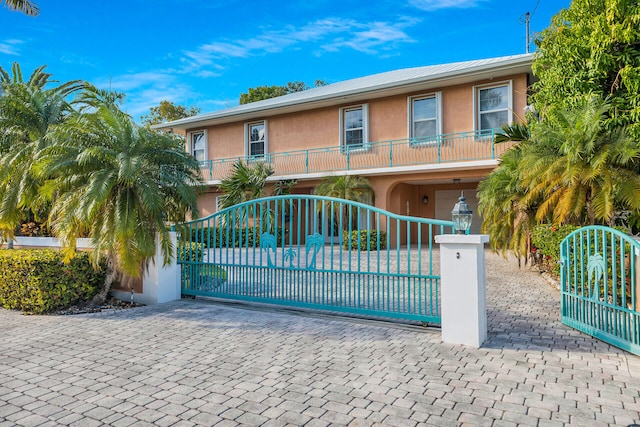 view of gate featuring a fenced front yard