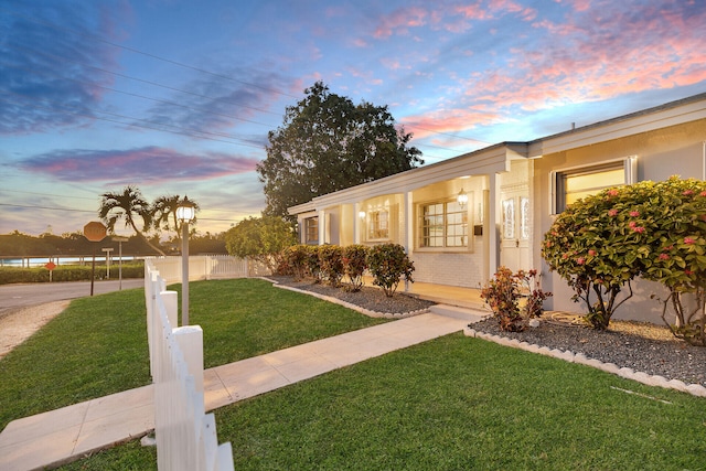 view of front of house with a lawn