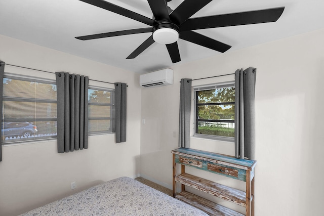 bedroom with multiple windows, a wall unit AC, and ceiling fan