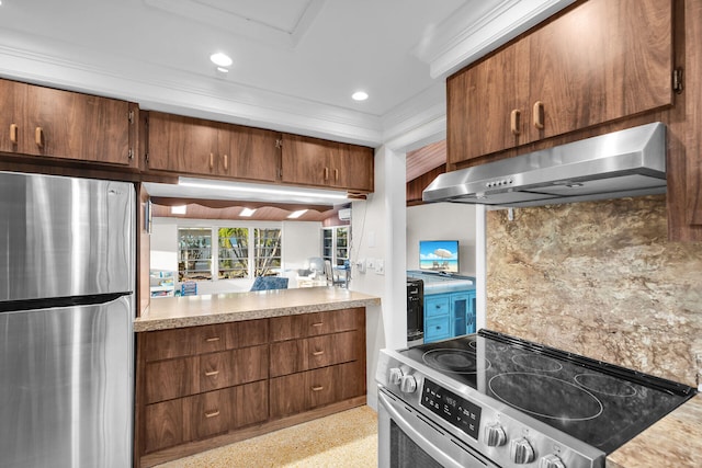 kitchen with tasteful backsplash, appliances with stainless steel finishes, crown molding, and wall chimney range hood