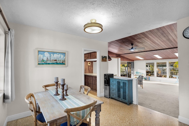 dining area featuring vaulted ceiling, ceiling fan, a textured ceiling, and wood ceiling