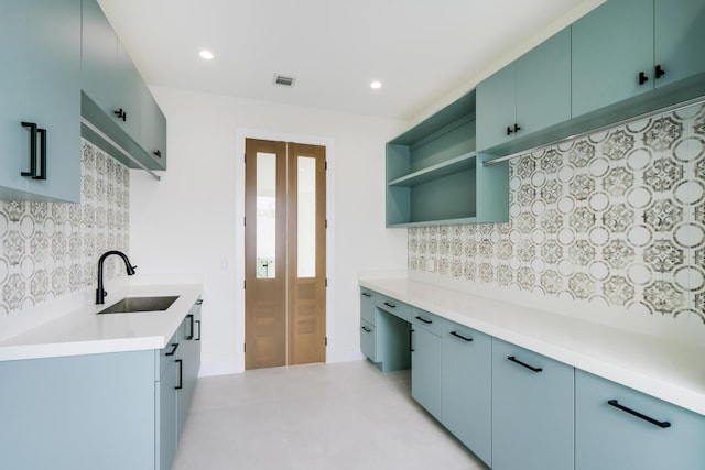 kitchen with tasteful backsplash and sink