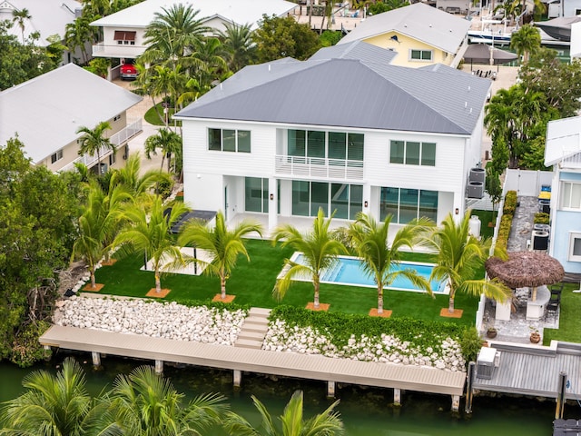 birds eye view of property featuring a water view