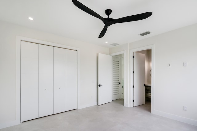 unfurnished bedroom featuring ensuite bathroom, ceiling fan, and a closet