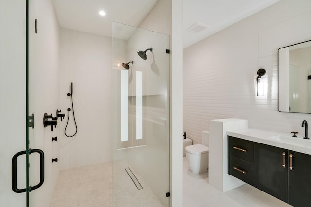 bathroom with tile patterned flooring, a shower with door, tile walls, and toilet