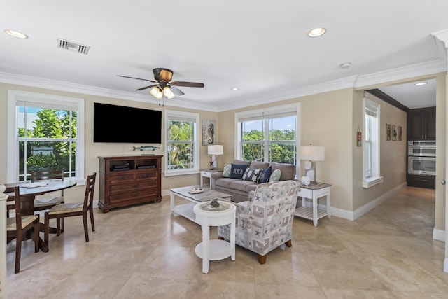 living room with plenty of natural light, visible vents, crown molding, and ceiling fan
