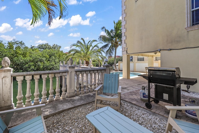 view of patio featuring a fenced in pool