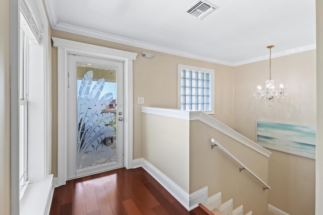 10 47th St, Gulf, Marathon, FL 33050 - foyer featuring dark wood finished floors, a chandelier, crown molding, and baseboards