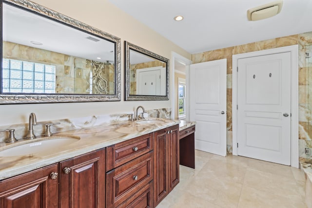 bathroom featuring a sink, visible vents, and double vanity